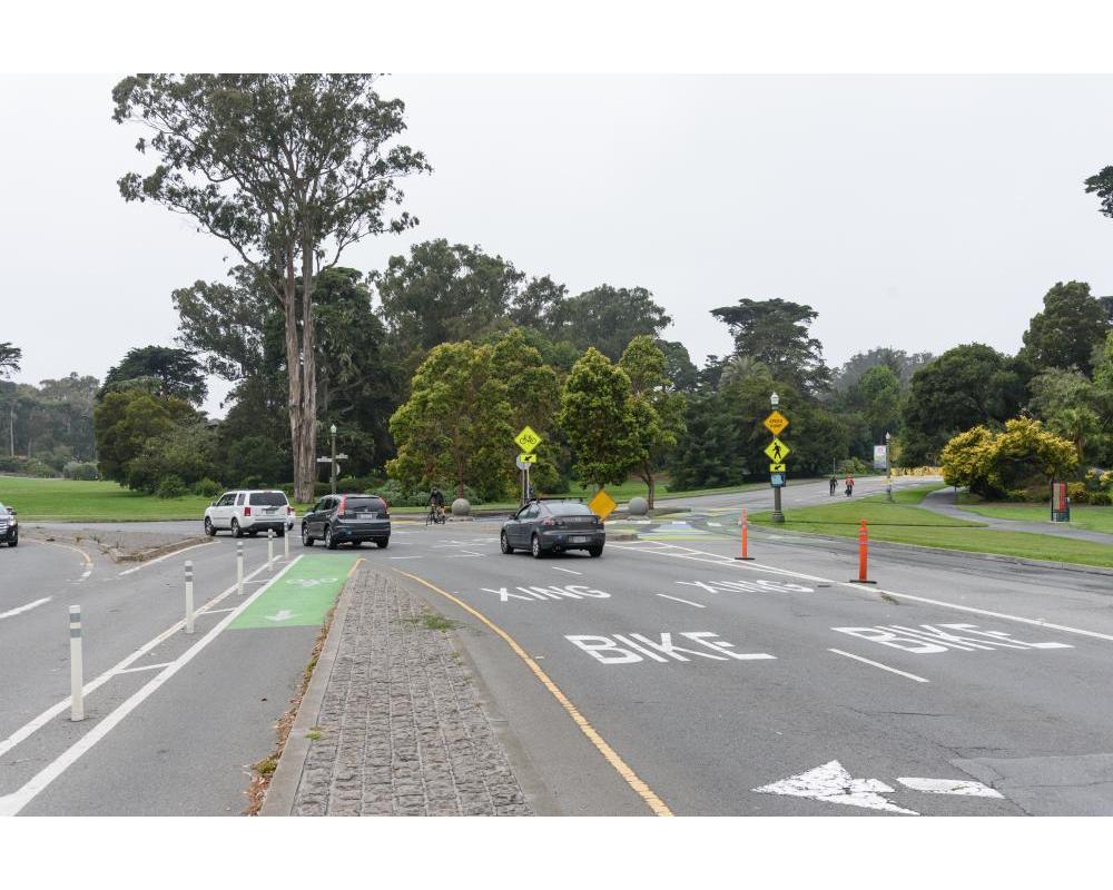 Bike and vehicle travel lanes looking west from Stanyan towards Golden Gate Park