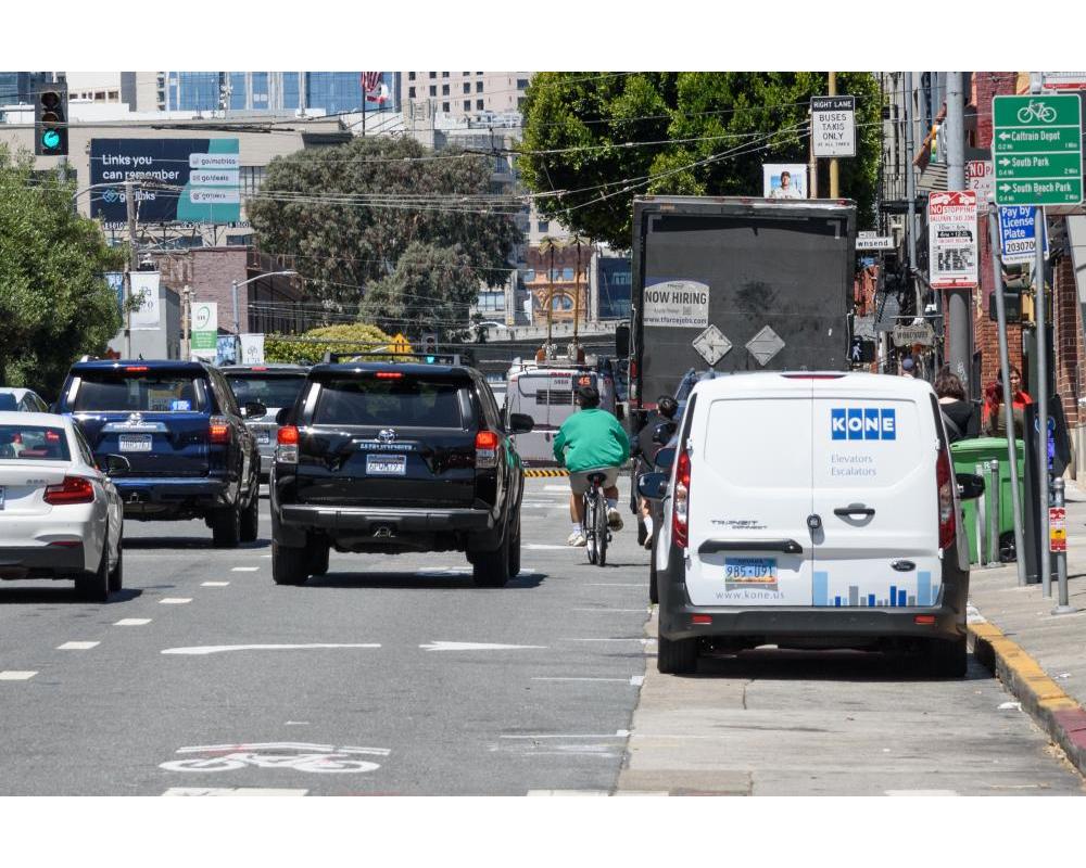 cyclist riding in traffic 
