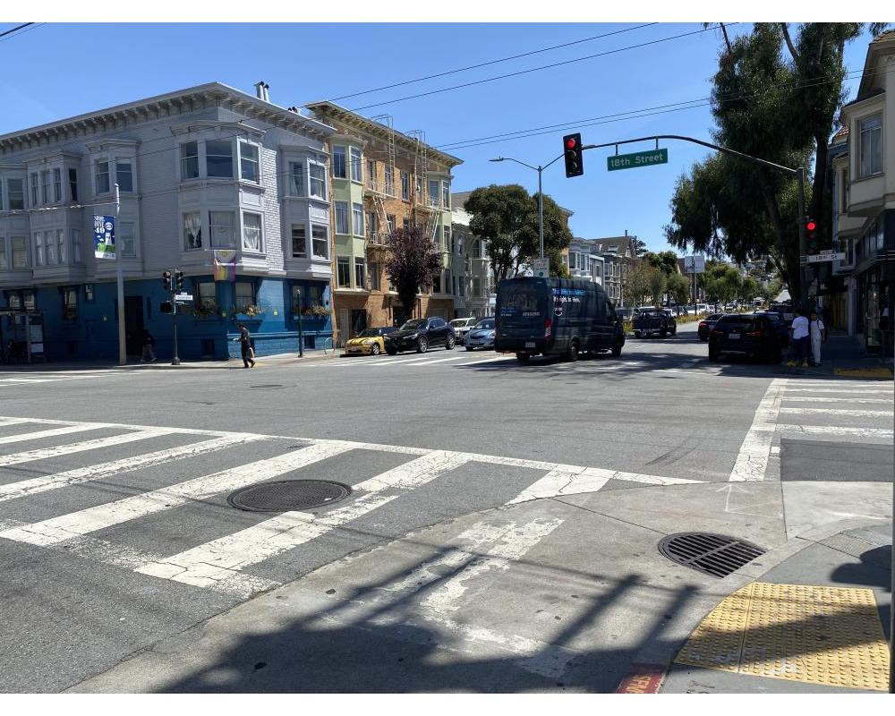 Intersection of Guerrero and 18th streets. Delivery trucks turning