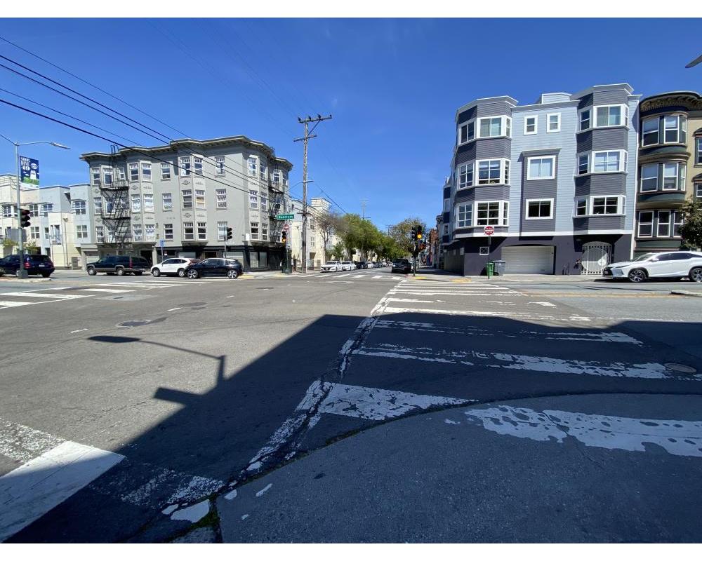Intersection of Guerrero and 15th streets showing a faded crosswalk