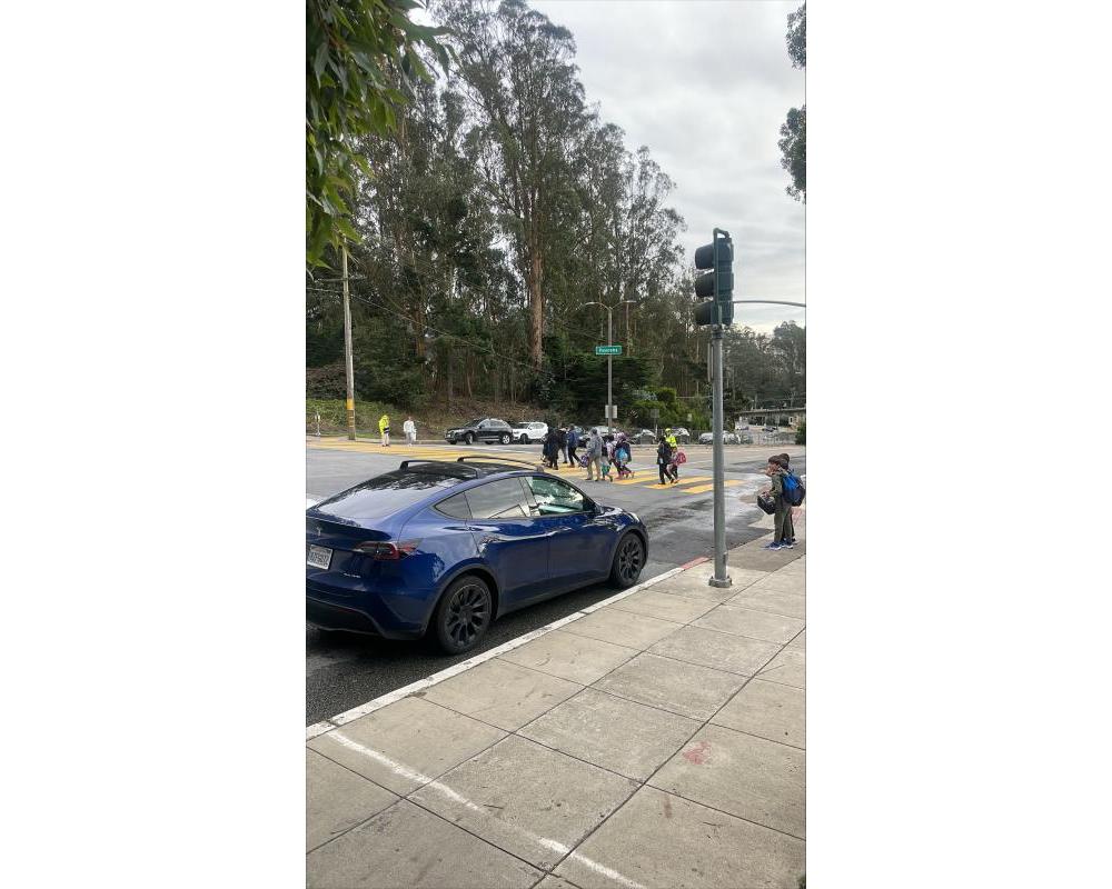 students crossing Clarendon Avenue at Panorama Drive crosswalk 