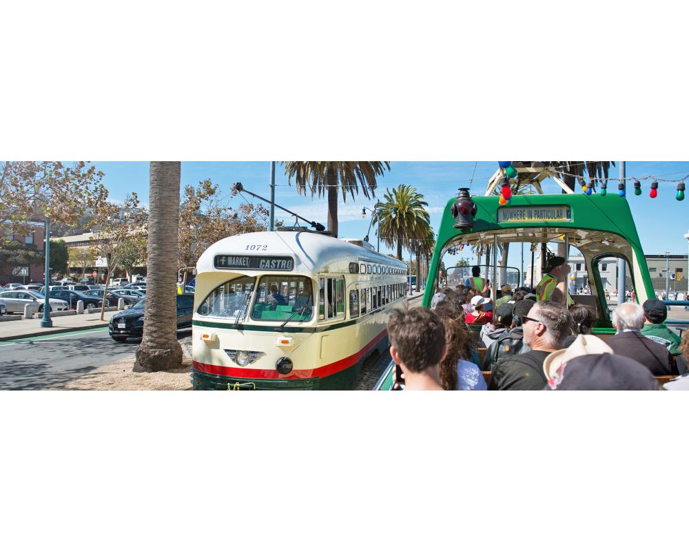 Historical Street Car and Boat Tram passing next to each other 