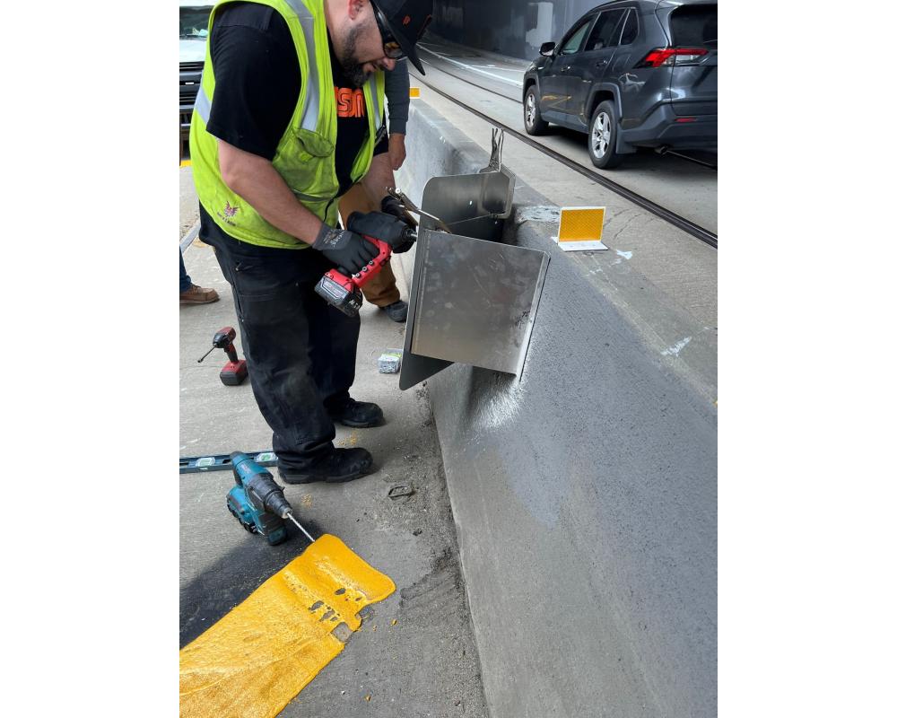 SFMTA staff welding a guard rail for a Fix It! program.