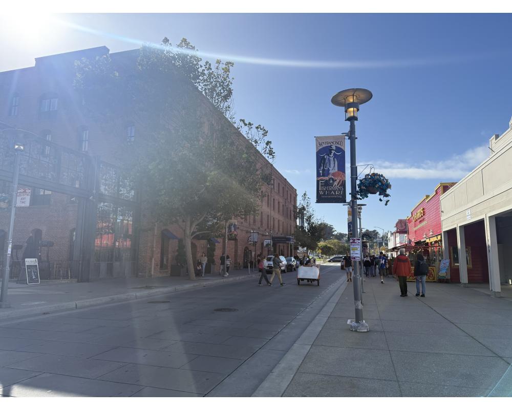 view of Jefferson Street facing west with pedestrians and a pedicab on the street