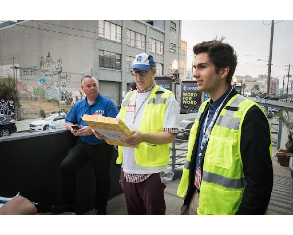 SFMTA Staff preparing community members for an in-person tour of the bus yard with translators and support.