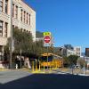 View of the traffic diverter at the intersection of Page and Webster streets, facing east toward Downtown