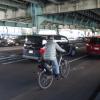 a bicyclist rides in mixed traffic