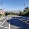 Clipper Street looking downhill at Grand View intersection with protected bikeway