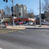 Image of person crossing the new surface-level crosswalk at Steiner