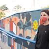 Artist Emily Fromm with her mural "East West Portal"