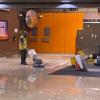 Custodians from Buildings and Grounds make the floor shine at Castro Station