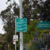 Directional bike signage, 40 MPH sign, and  St. Mary's Park Footbridge
