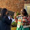 San Francisco Mayor London Breed and Board of Directors member Dominica Henderson facing each other at a swearing in ceremony. 