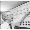 Man pointing at a train management panel