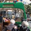 Riders on the open-topped boat style Blackpool streetcar on the Embarcadero