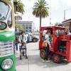 Family enjoying Muni Heritage Weekend's interactive installations: Vintage cars and Mini truck