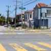 Intersection with yellow posts that prevent large vehicles from crossing through a street.