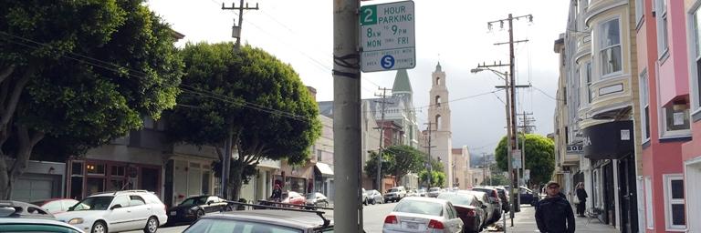 Image of a residential street with curb-side parking