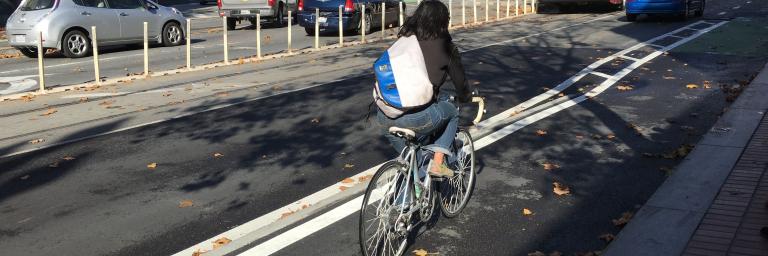 Person riding a bike on Market