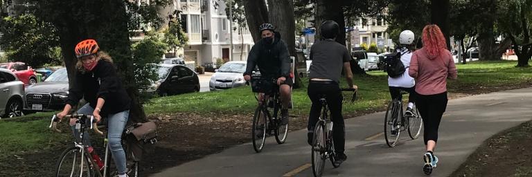 People running and biking on the Pandhandle