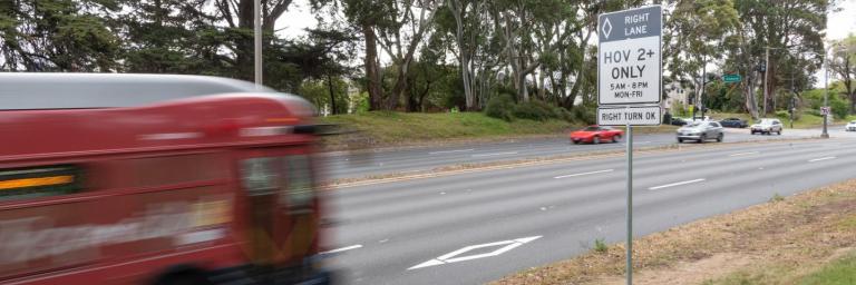 bus driving on high occupancy vehicle lane on park presidio 