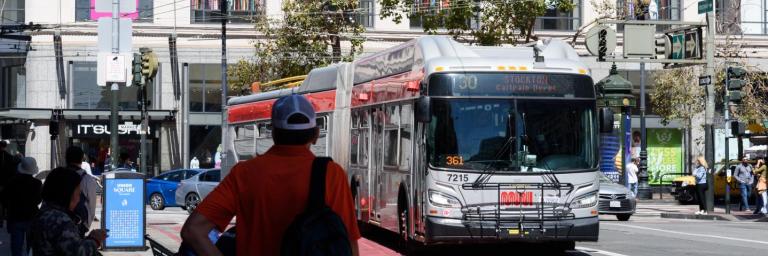 Riders waiting to board the 30 Stockton Muni bus