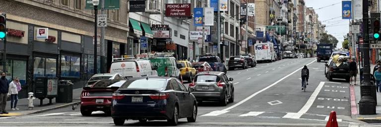 Vehicles and bicycle traffic traveling west on Sutter Street