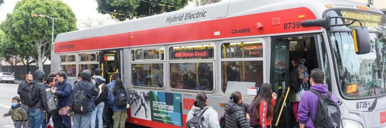 Riders board the 48 Quintara-24th Street, one of Muni’s Equity Strategy routes.