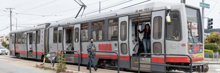 Customers getting off train at Santa Rosa Avenue. 