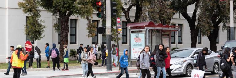 Children crossing street with guard after school is out