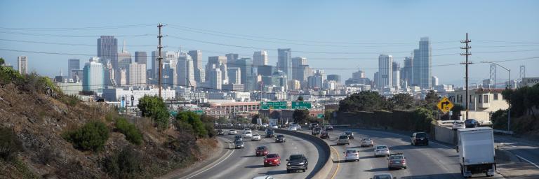 cars on freeway with skyline