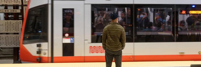 Person waits for train at the Chinatown Rose Pak Station of the Central Subway