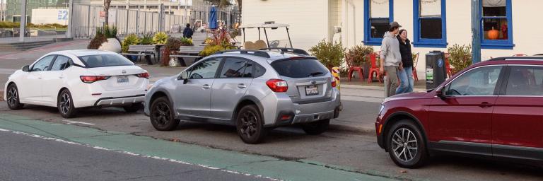 Cars parked inside a bike lane