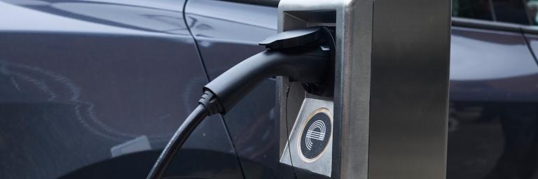 Curbside Electric Vehicle Charger with car plugged in