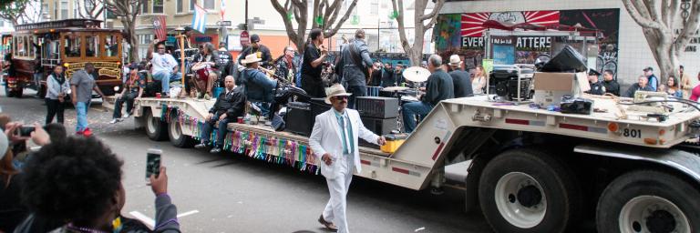 SFMTA & Muni contingent in Carnaval Parade with Motorized Cable Car and Band on Flatbed Trailer | May 28, 2017