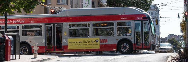 5 Fulton trolly bus traveling on Divisadero