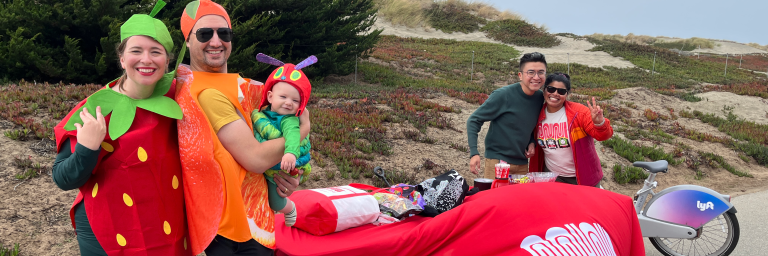 Great Hauntway Muni Table with family dressed as the very hungry caterpillar and Muni Staff