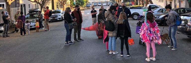Families celebrating Halloween festivities on Minnesota Slow Street