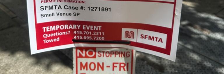 Photo showing bottom half of Self-Posted Temp Sign posted on commercial loading meter pole