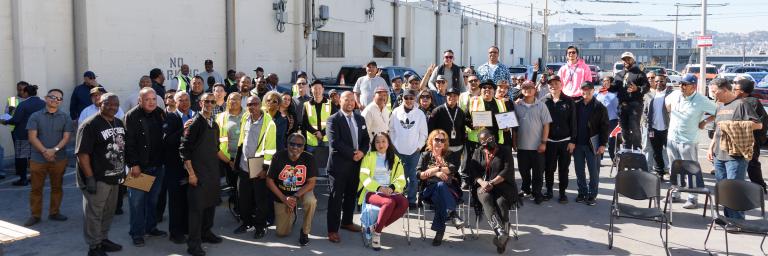 Muni staff pose on the roof of Potrero Yard to celebrate Operator of the Month