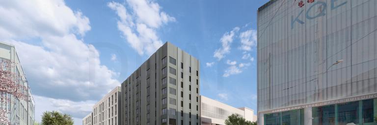 rendering showing a modern urban bus facility with adjacent housing units