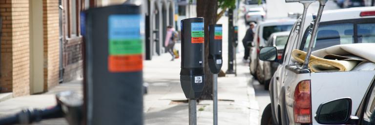 Row of updated parking meters that have new payment options