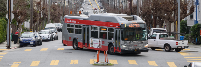 1 California bus making a turn through an intersection