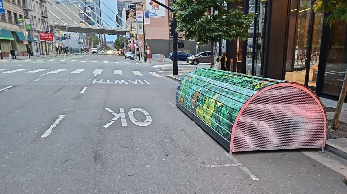 SFMTA’s new bikehangar at Howard & 2nd streets, looking east, in the parking lane on the south side of the street. SFMTA’s new bikehangar at Howard & 2nd streets, looking east, in the parking lane on the south side of the street.