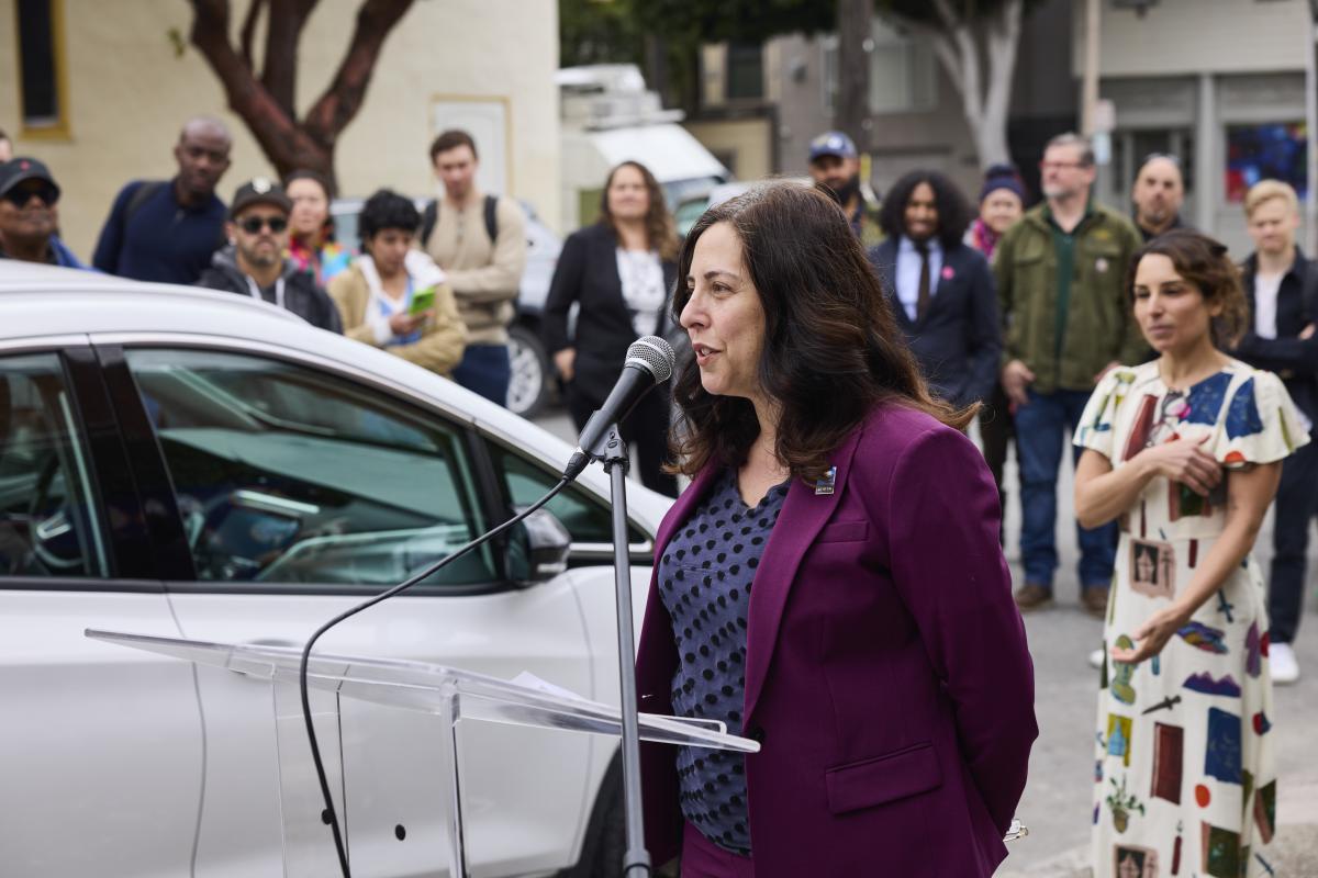 SFMTA Director of Transportation Julie Kirschbaum speaks at the launch event for new curbside EV charging stations in Duboce Triangle.