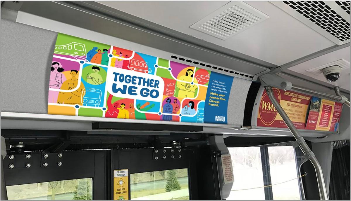 View of the inside of a Muni bus with a bus card for the Together We Go campaign. 