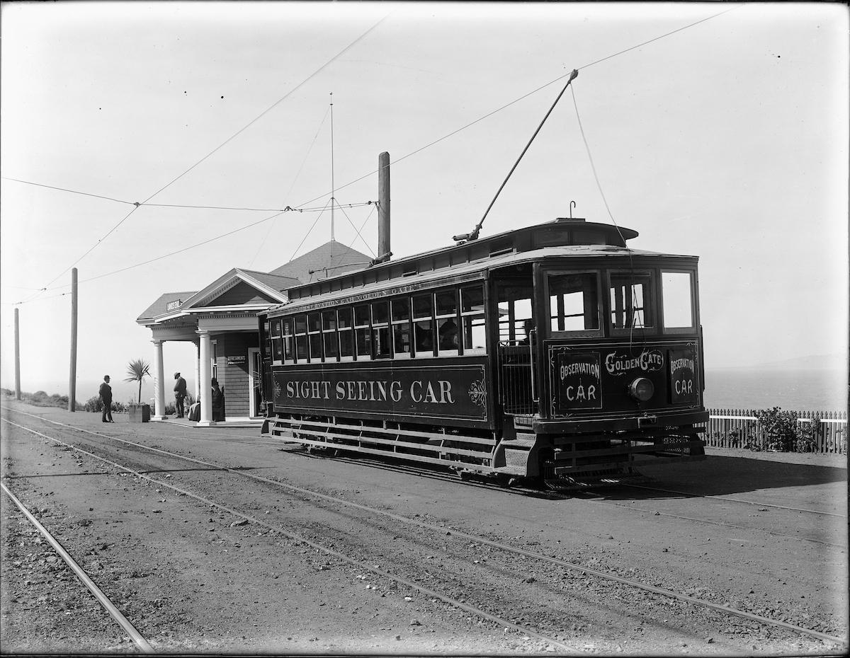 Black and white photo of a historic sightseeing car that served the former Land's End Station.