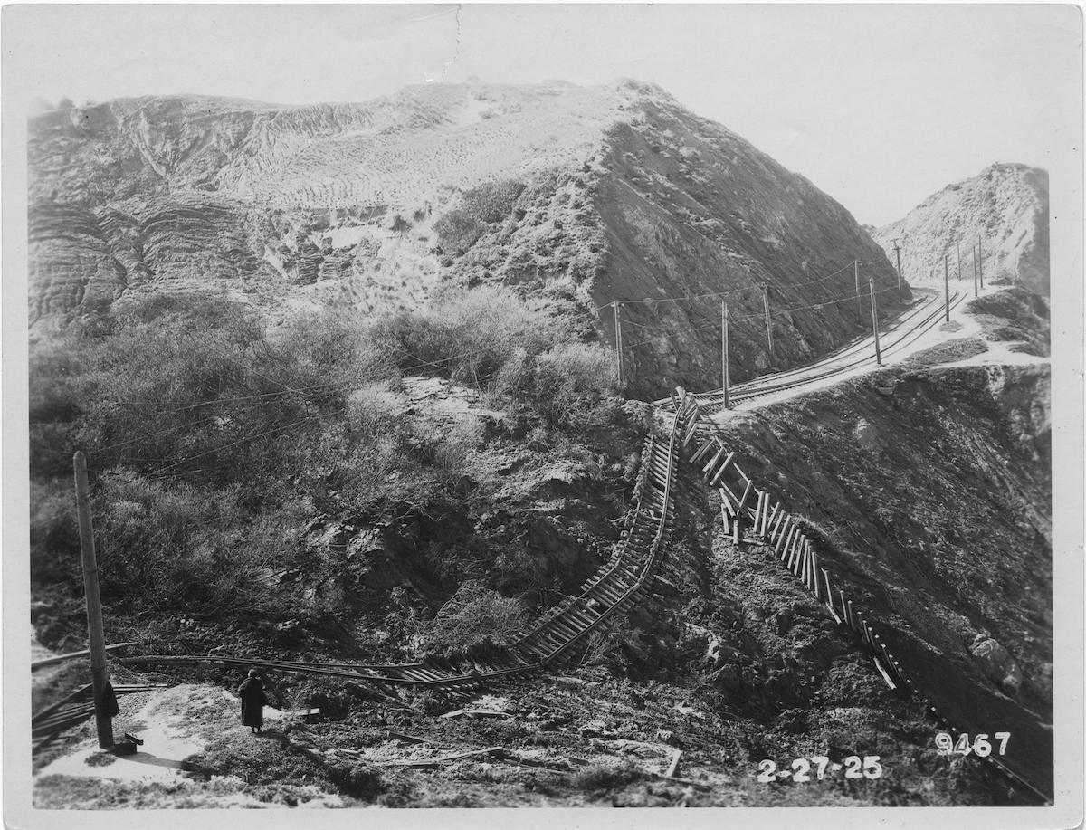 Black and white photo showing impact of a landslide that destroyed train tracks near Land's End.