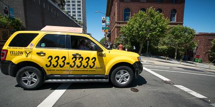 Photo of an Yellow Cab taxi.