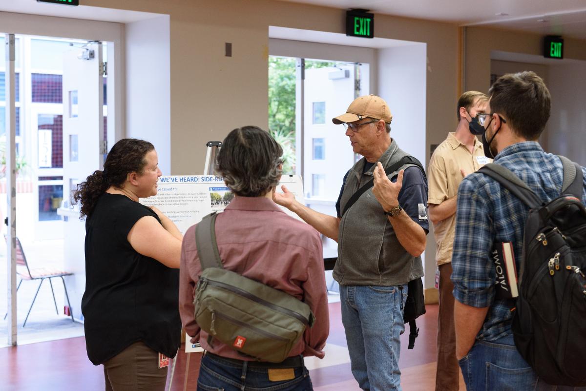 Nehama Rogozen hears from community members during a public meeting.